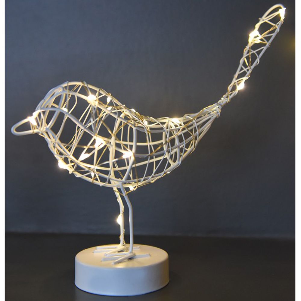 Decorative light fixture shaped like a bird on a dark background