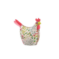Decorative chicken-shaped decor with floral pattern on a white background