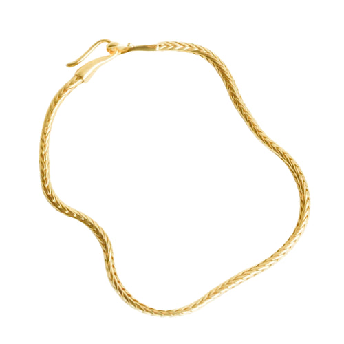 Gold bracelet on a white background