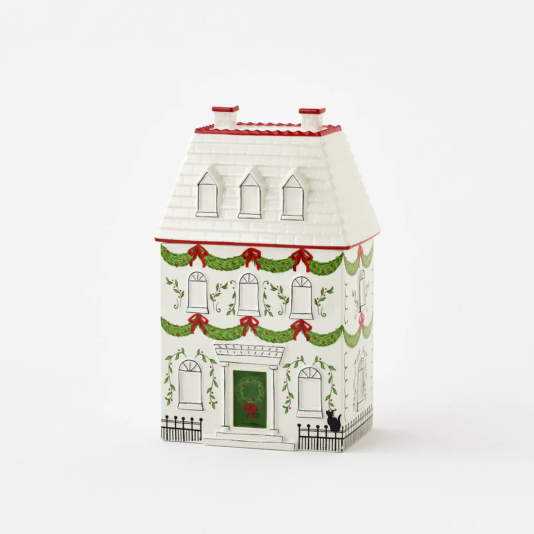 Decorative house-shaped box with Christmas-themed design on a white background