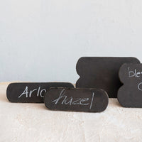 Black chalkboard signs with names 'Arlo' and 'Hazel' on a light background
