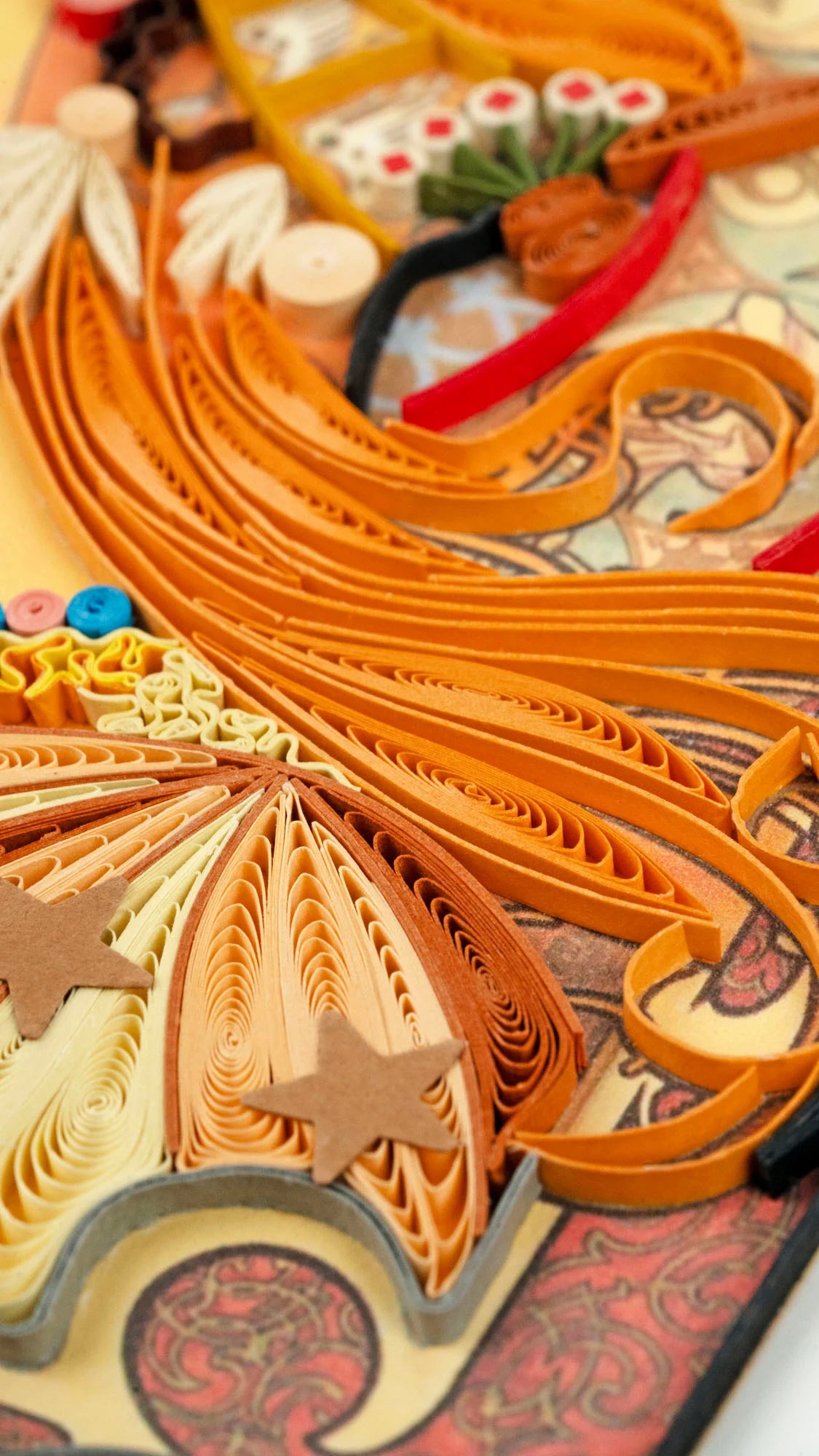 Closeup of quilled greeting card featuring Alphonse Mucha's 1896 lithograph 'Zodiac'
