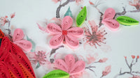 Quilled flowers and leaves on a floral background