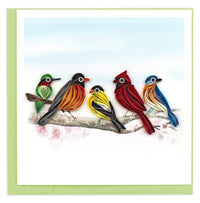 Colorful greeting card featuring quilled birds on a branch on a green envelope on a white background.