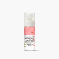 Bottle of Beekman 1802 Milk Shake Moisture Mist for Body on a white background