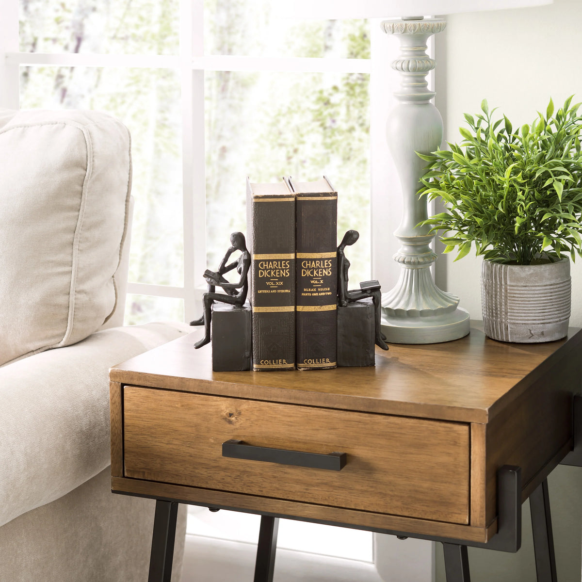 Man and Woman Reading on a Block Cast Iron Bookend Set | Danya B.