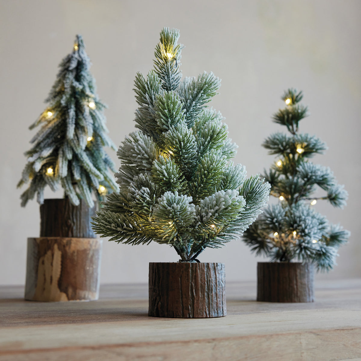 Plastic Snowy Tree with Faux Wood Slice Base & LED Lights