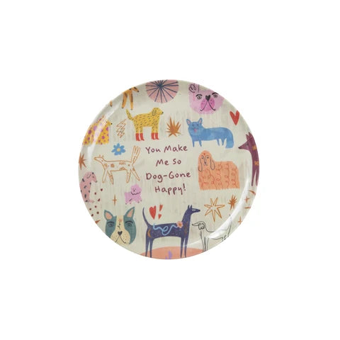 A round ceramic plate with a whimsical dog-themed pattern on a white background. The design features various colorful dogs, hearts, and the text 'You Make Me So Dog-Gone Happy!' in a playful, hand-drawn style.