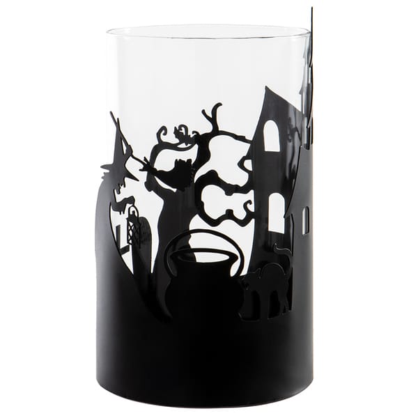 A black cylindrical candle holder or vase with a Halloween-themed silhouette cutout design featuring a witch, cat, cauldron, and haunted house, shown against a plain white background.